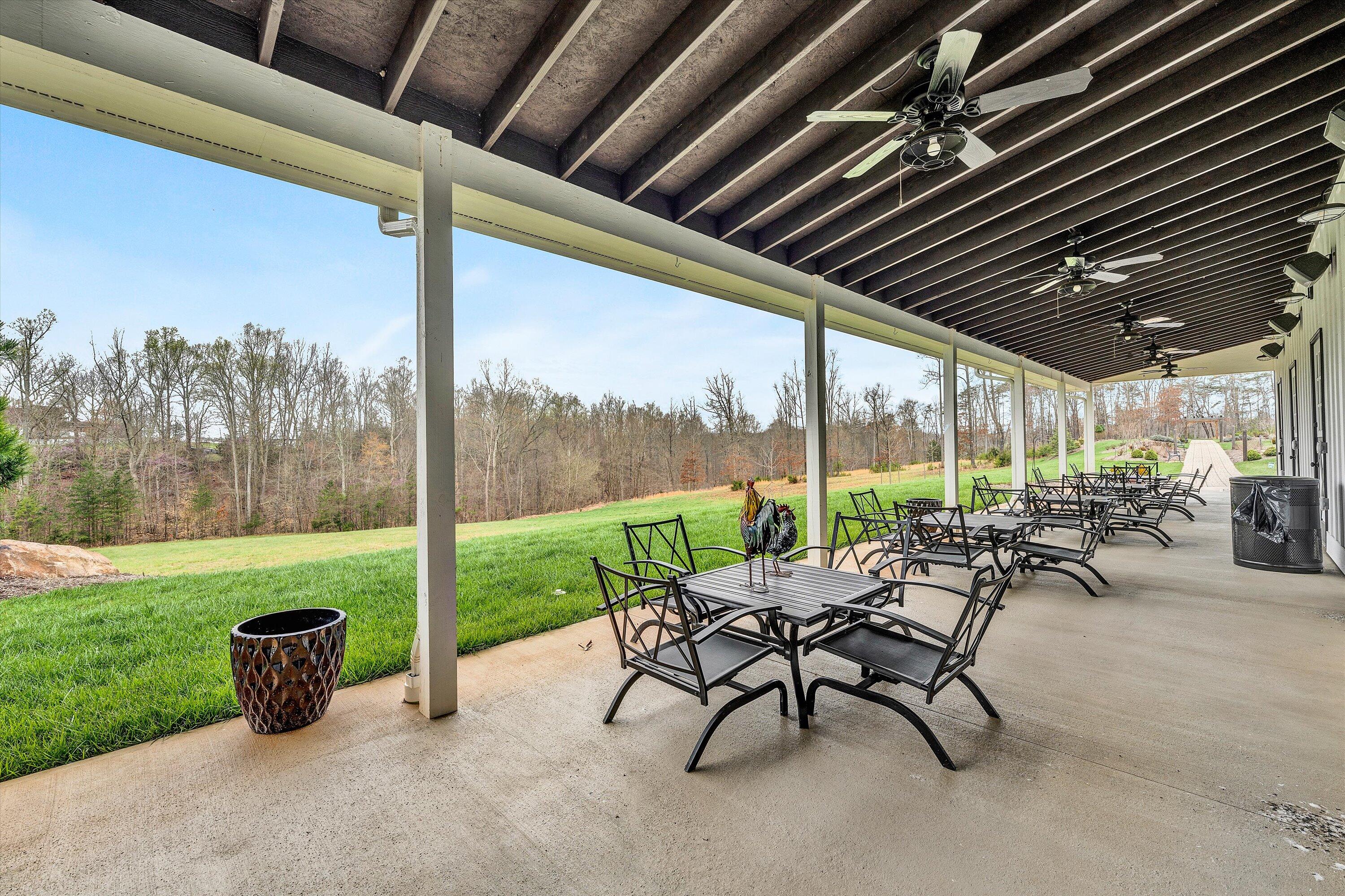 9945 Brooks Mill Road Wirtz, VA 24184 - Photo 39 of 50 a view of a patio with chairs and table in patio