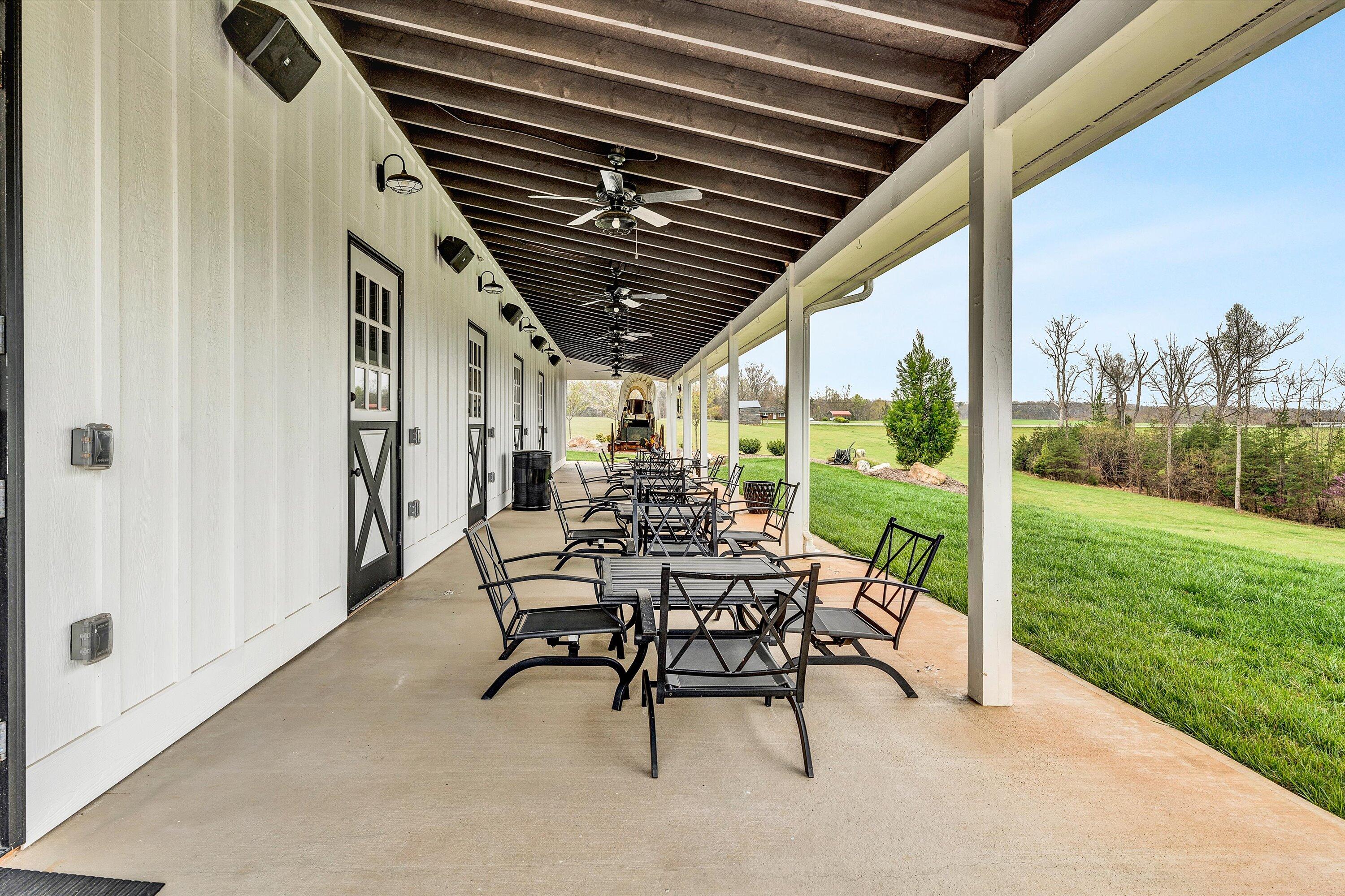 9945 Brooks Mill Road Wirtz, VA 24184 - Photo 40 of 50 a view of a porch with chairs and backyard