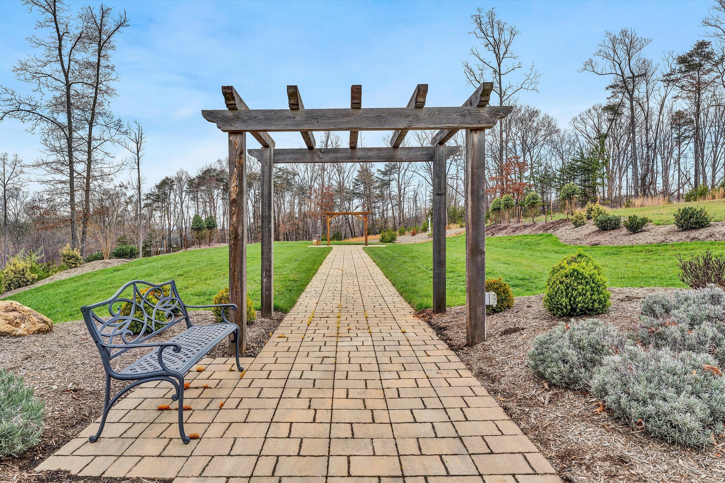9945 Brooks Mill Road Wirtz, VA 24184 - Photo 45 of 50 a view of a patio with a table chairs and a yard