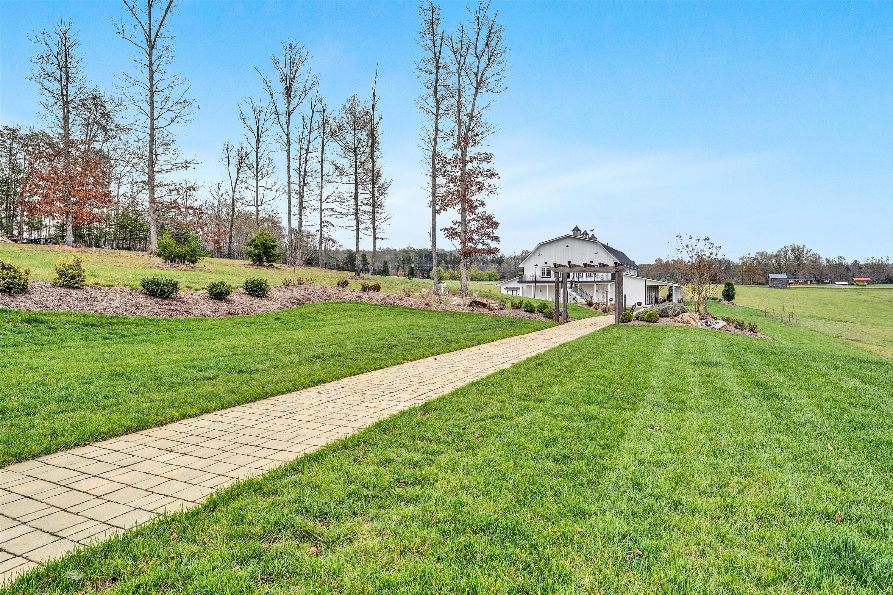 9945 Brooks Mill Road Wirtz, VA 24184 - Photo 48 of 50 a view of a garden with houses