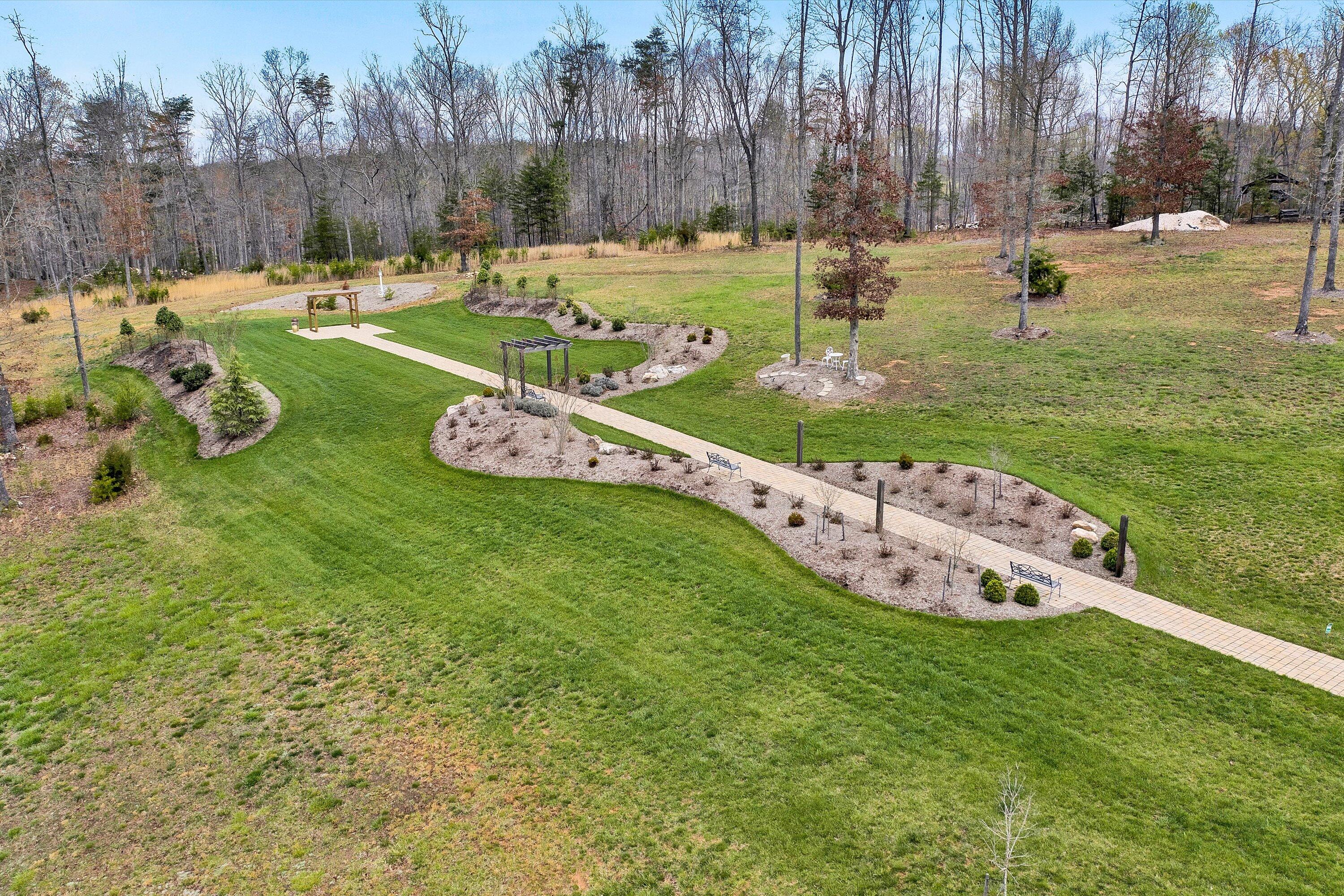 9945 Brooks Mill Road Wirtz, VA 24184 - Photo 50 of 50 a swimming pool with outdoor seating and yard