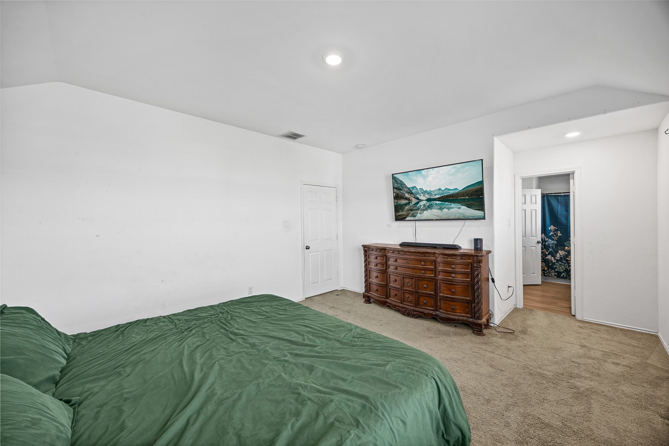 5976 Rimini Landing Lane Porter, TX 77365 - Photo 12 of 18 a bedroom with a bed and a cabinets