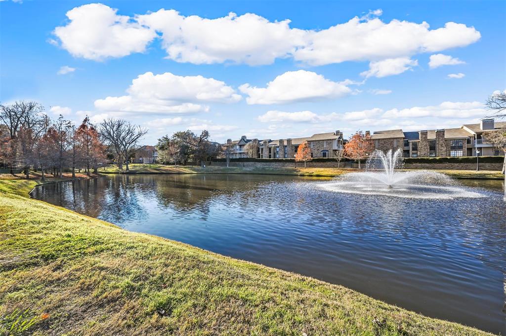 14277 Preston Road, Unit 714 Dallas, TX 75254 - Photo 1 of 1 a view of a lake with houses