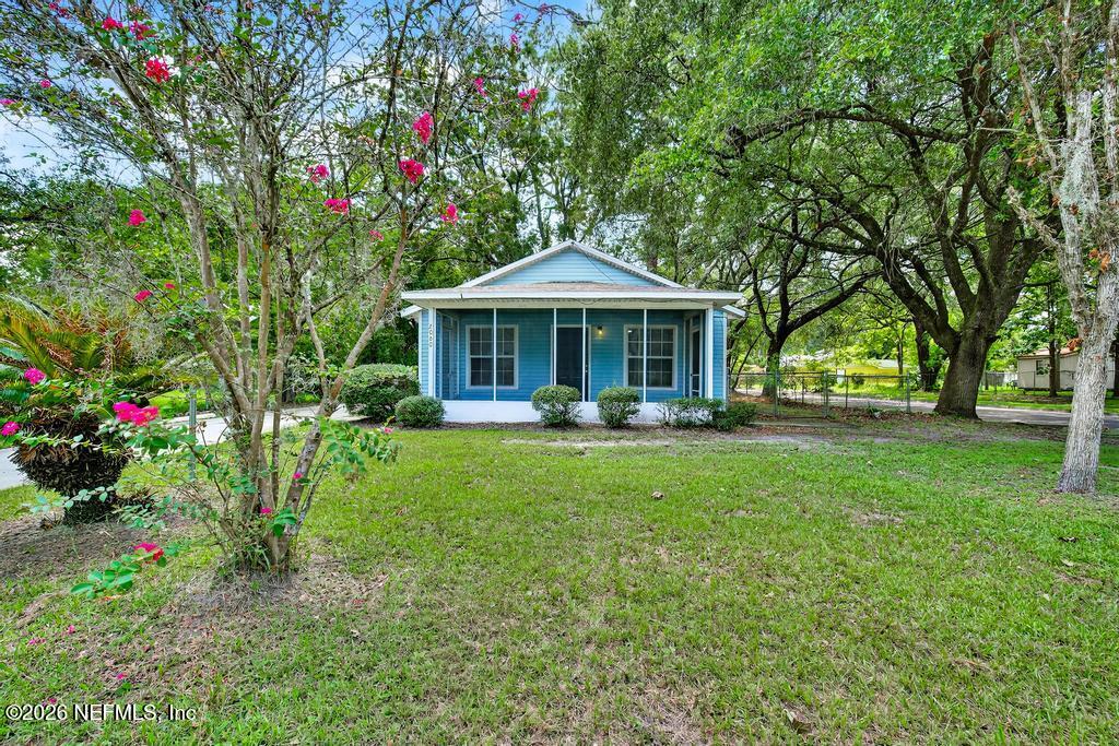 a front view of a house with garden