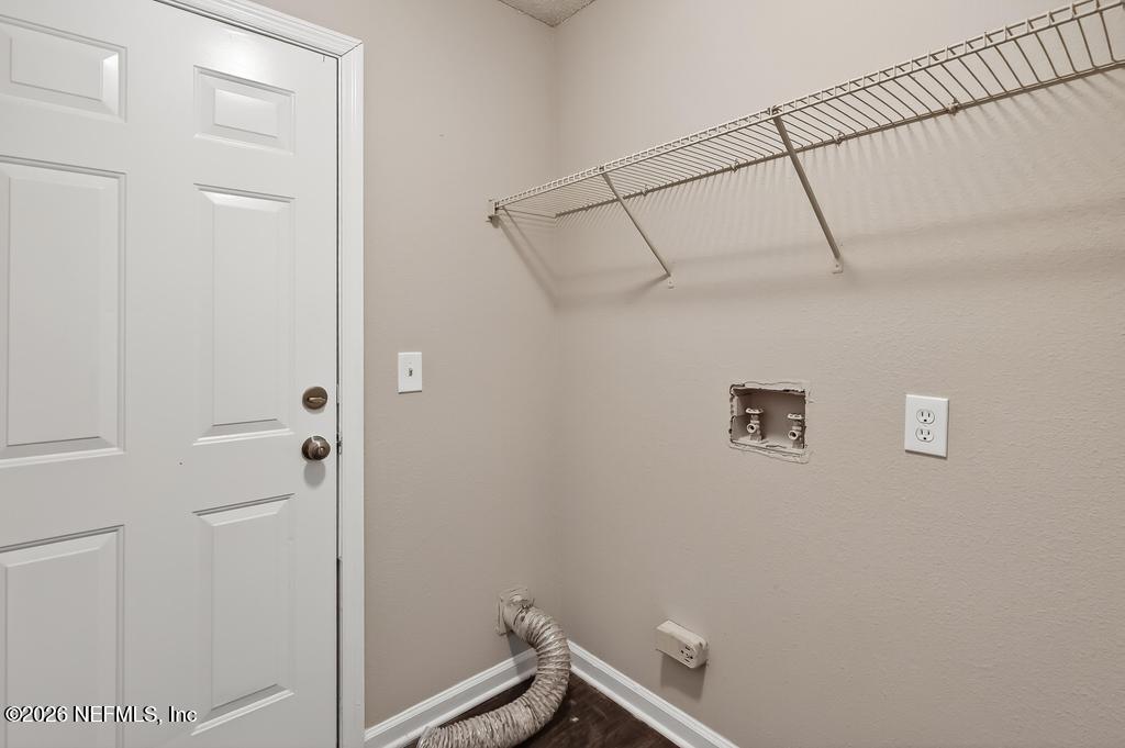 2080 Tuskegee Road Jacksonville, FL 32209 - Photo 19 of 23 a view of a room with racks on the wall