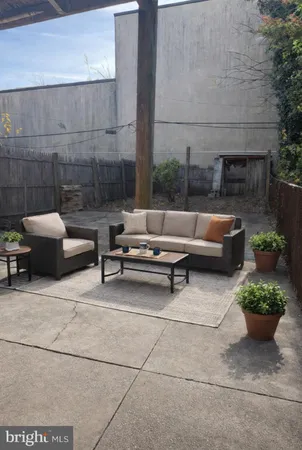 a outdoor space with patio furniture and a fireplace