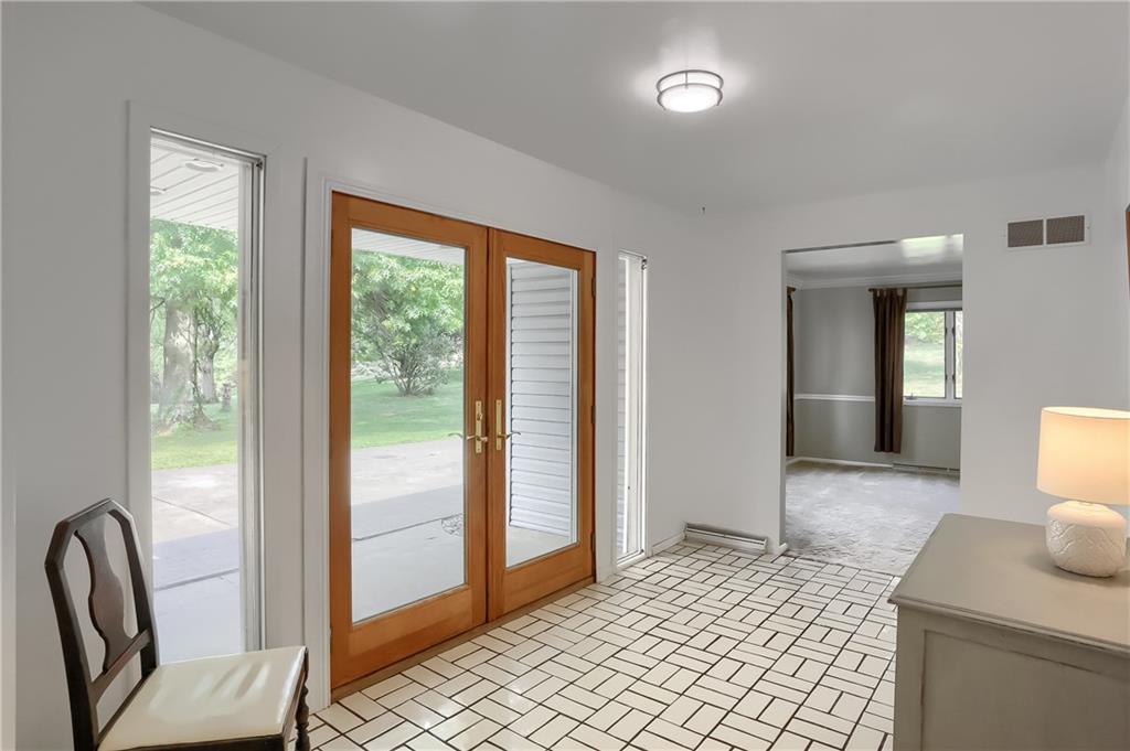 566 Zeigler Road Rochester, PA 15074 - Photo 14 of 50 a view of a hallway with furniture and a window