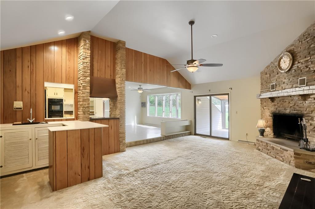566 Zeigler Road Rochester, PA 15074 - Photo 15 of 50 a view of a kitchen with a sink and a fireplace