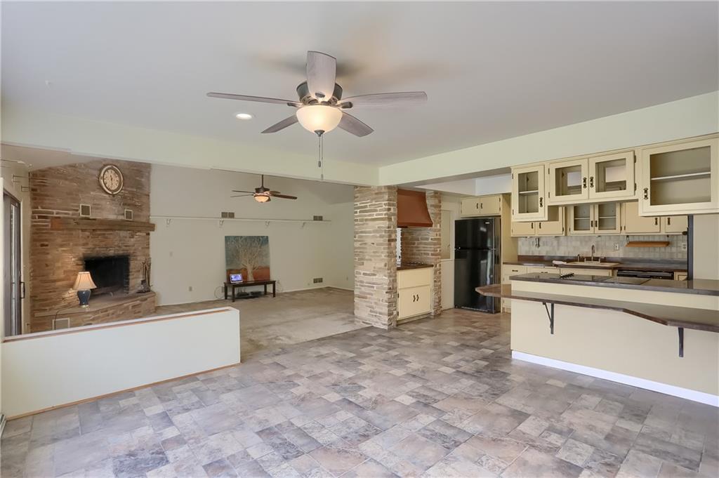 566 Zeigler Road Rochester, PA 15074 - Photo 19 of 50 a view of a kitchen with a stove cabinets and a floor to ceiling window