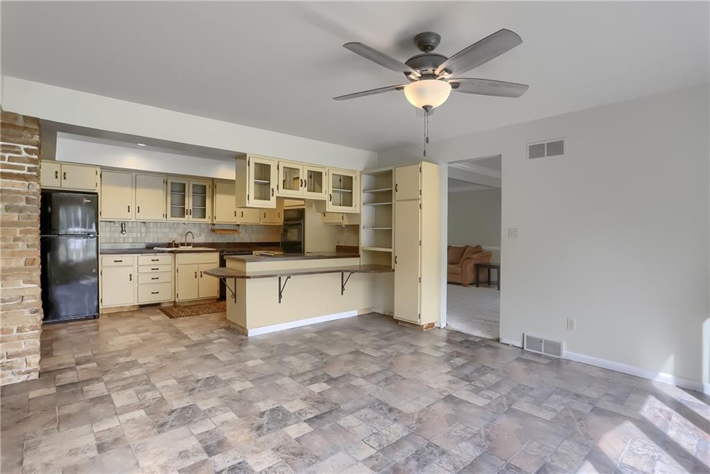 566 Zeigler Road Rochester, PA 15074 - Photo 20 of 50 a large kitchen with cabinets and stainless steel appliances