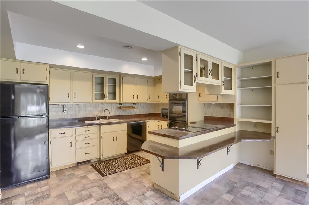 566 Zeigler Road Rochester, PA 15074 - Photo 21 of 50 a kitchen with granite countertop a sink stove and refrigerator