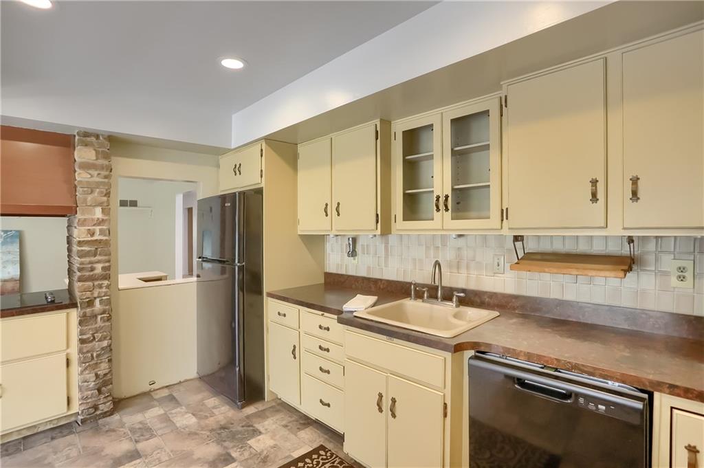 566 Zeigler Road Rochester, PA 15074 - Photo 24 of 50 a kitchen with stainless steel appliances granite countertop a refrigerator and a sink
