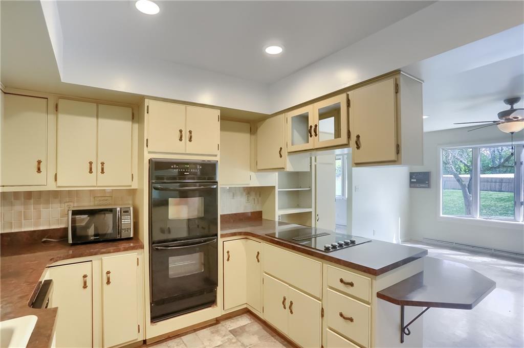 566 Zeigler Road Rochester, PA 15074 - Photo 25 of 50 a kitchen with stainless steel appliances granite countertop a stove refrigerator and cabinets