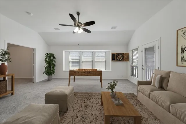 a living room with furniture and window