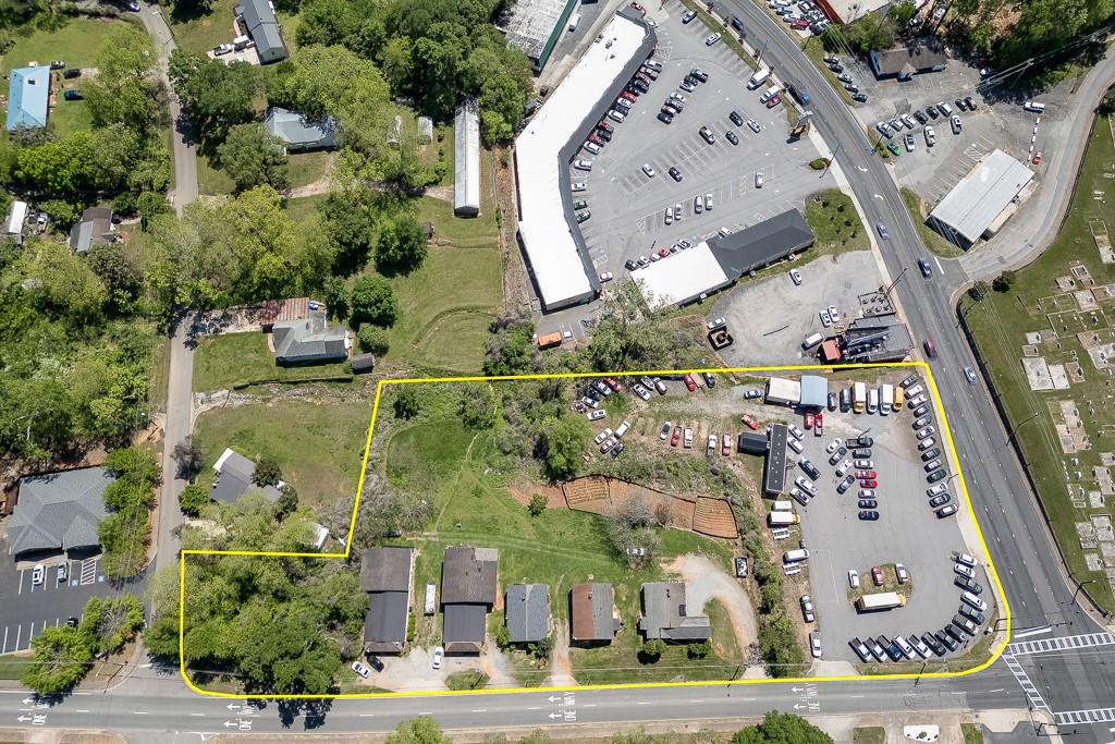 116 East Maple Street Cumming, GA 30040 - Photo 2 of 15 an aerial view of a residential apartment building with a yard and potted plants