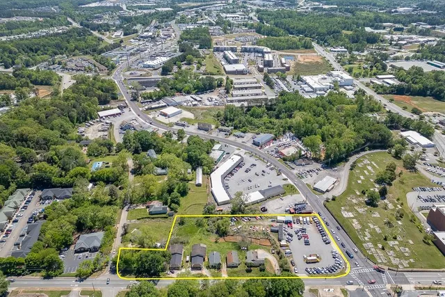 an aerial view of residential houses with outdoor space