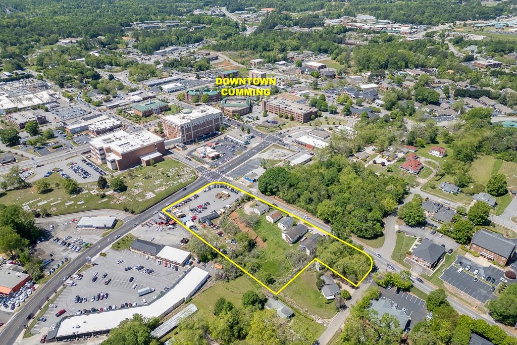 116 East Maple Street Cumming, GA 30040 - Photo 5 of 15 an aerial view of residential houses with outdoor space