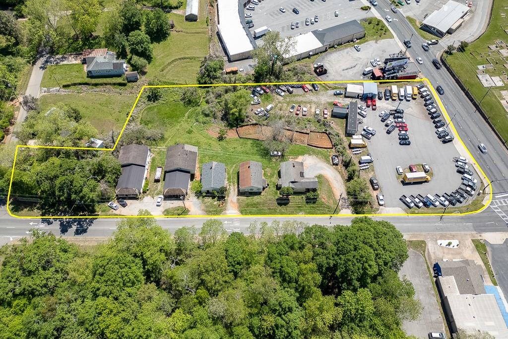 116 East Maple Street Cumming, GA 30040 - Photo 6 of 15 an aerial view of residential houses with outdoor space