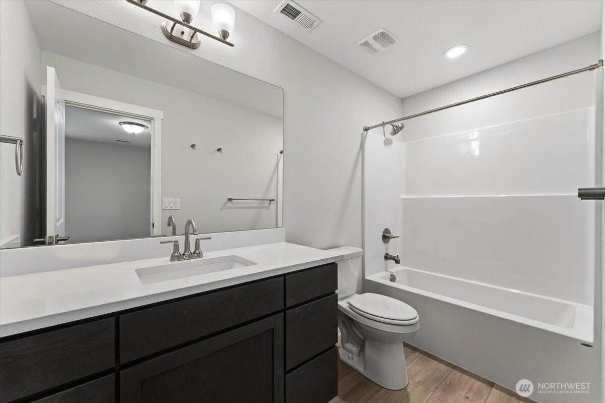 36 Simpson Street Mansfield, WA 98830 - Photo 14 of 28 a bathroom with a sink a toilet and shower