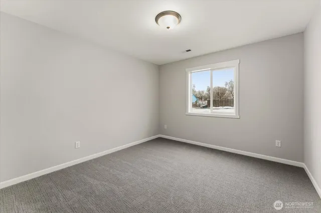 an empty room with closet area