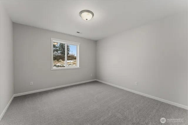 an empty room with closet area