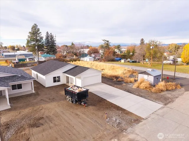 a view of a terrace with lawn chairs
