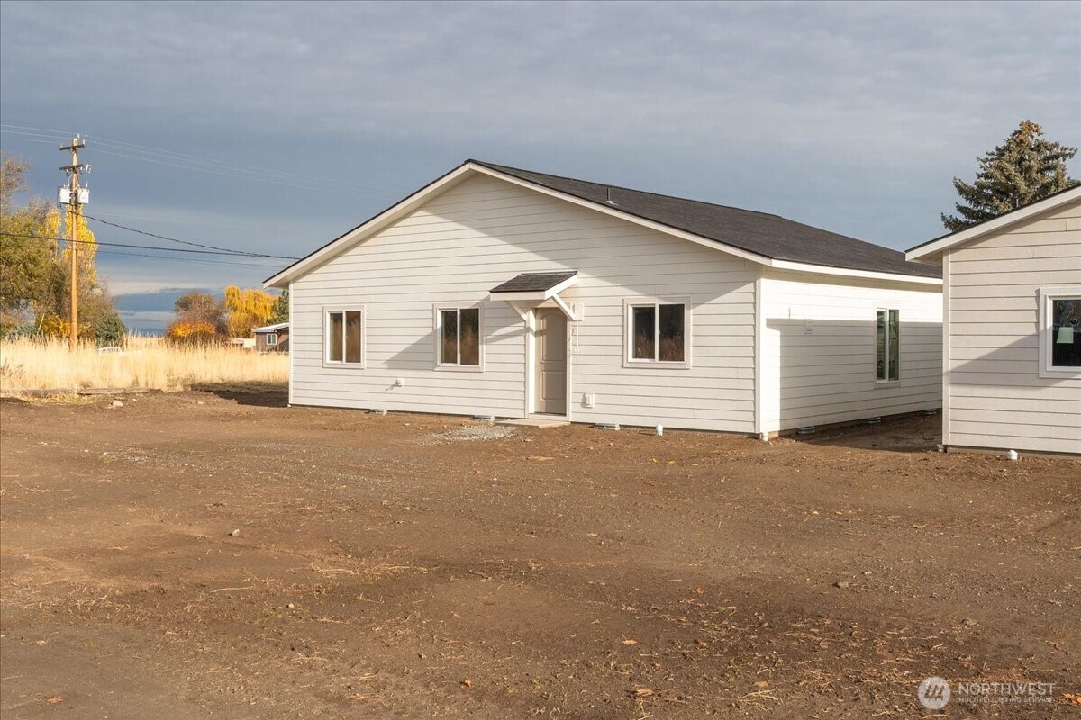 36 Simpson Street Mansfield, WA 98830 - Photo 22 of 28 a view of a house with a backyard