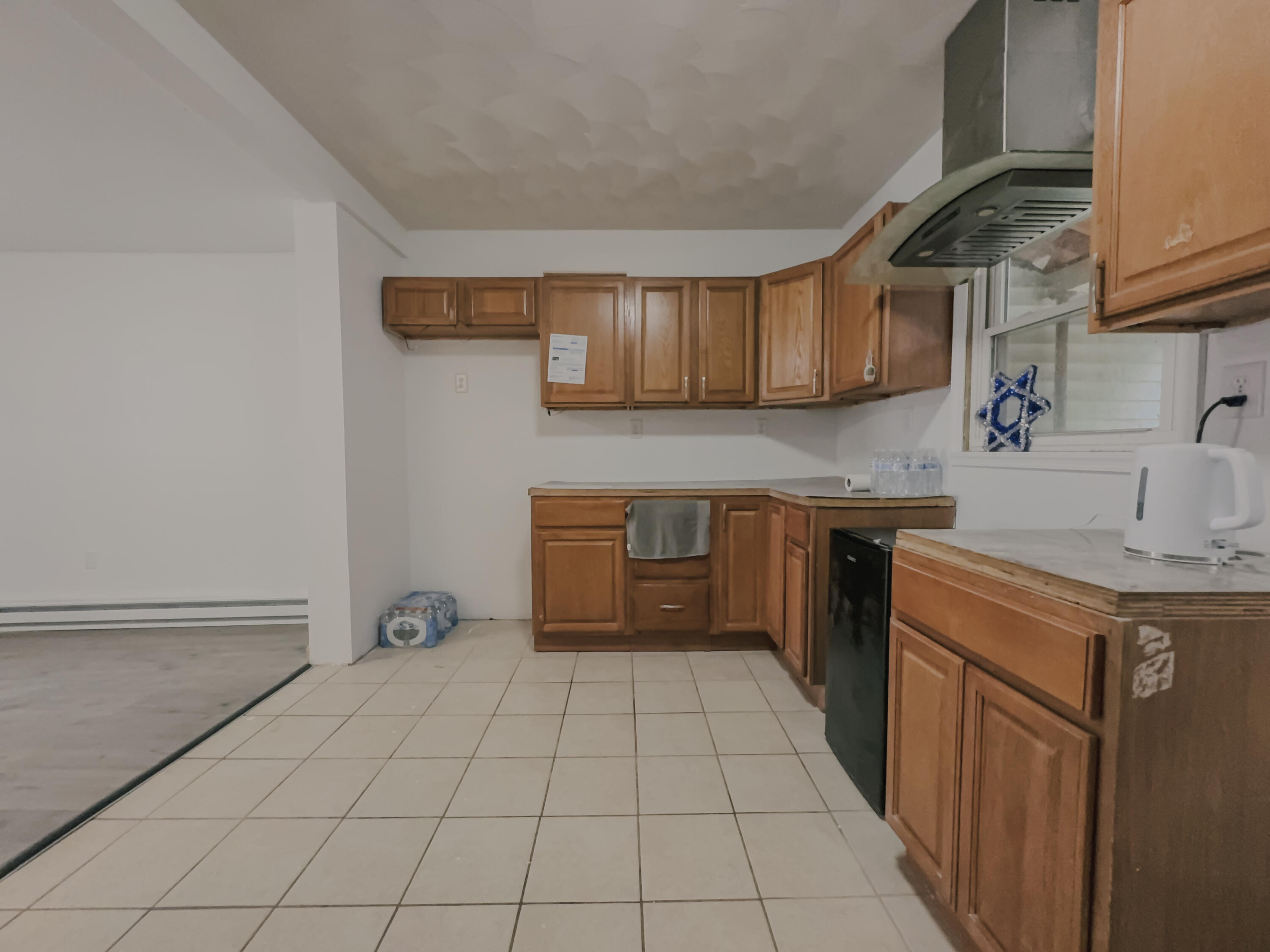 206 West Main Street Tremont, PA 17981 - Photo 5 of 13 a kitchen with a sink a stove top oven and cabinets