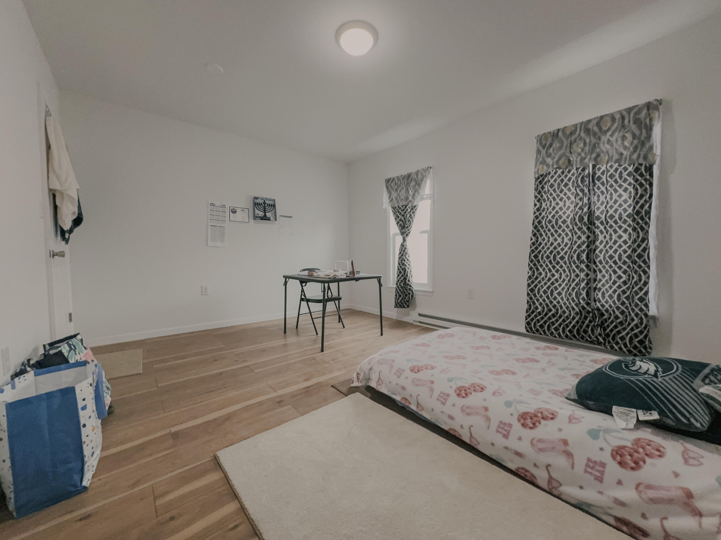 206 West Main Street Tremont, PA 17981 - Photo 10 of 13 a bedroom with a bed and a table in it