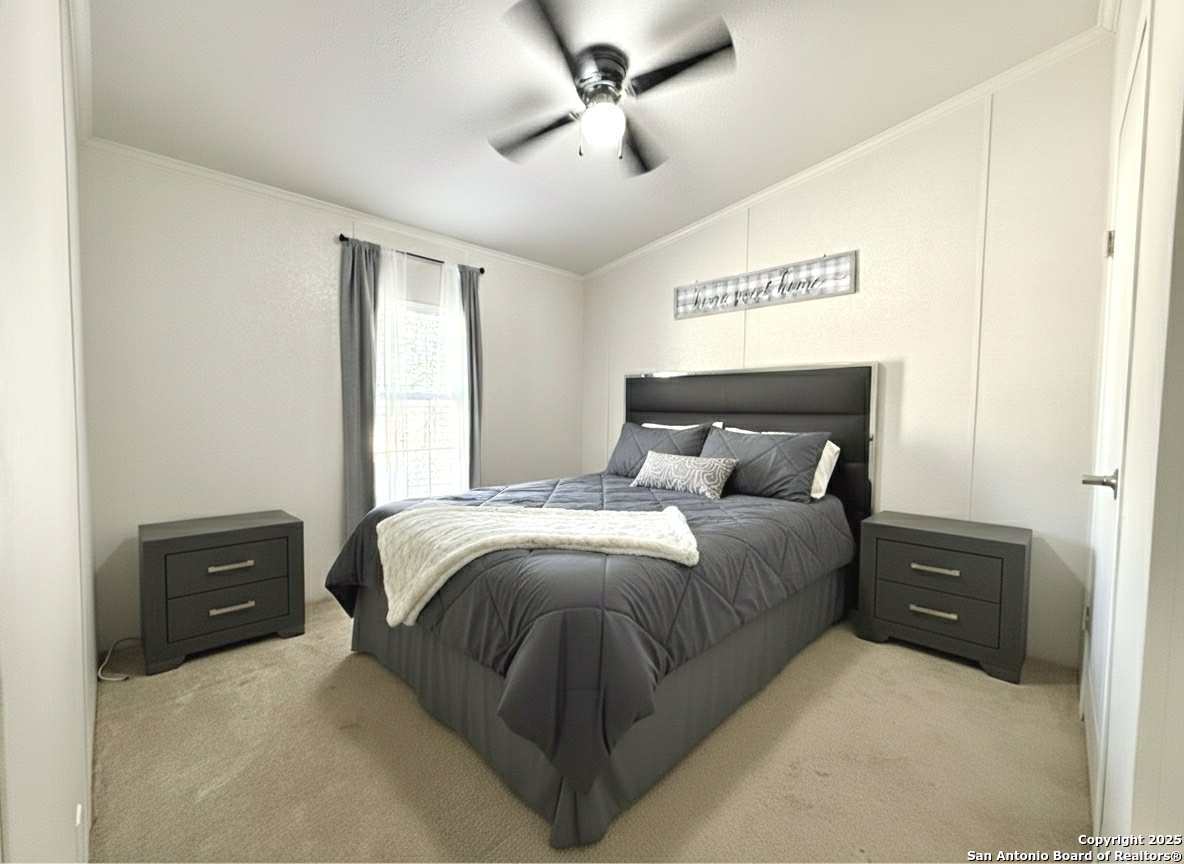 202 South 10th Christine, TX 78012 - Photo 13 of 28 a bedroom with a bed and window