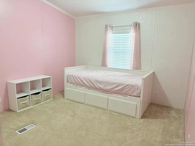 a bedroom with a bed and a cabinets