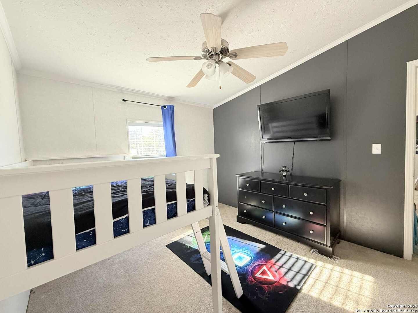 202 South 10th Christine, TX 78012 - Photo 19 of 28 a living room with furniture and a flat screen tv