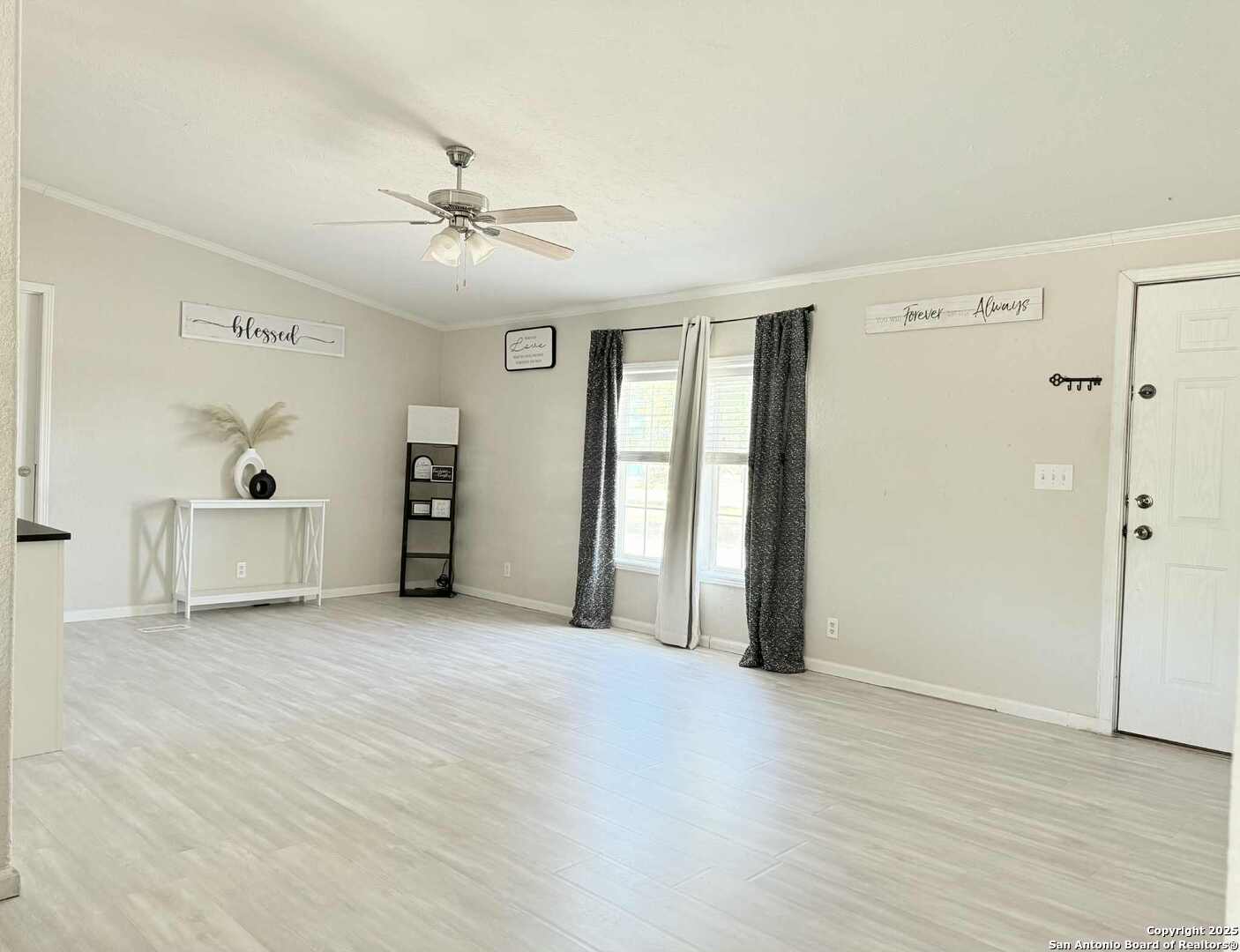 202 South 10th Christine, TX 78012 - Photo 2 of 28 wooden floor in an empty room