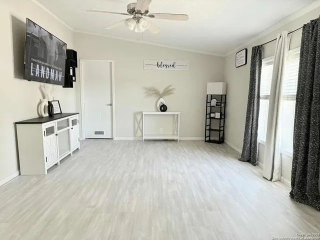 a view of a kitchen with a sink cabinet and a window