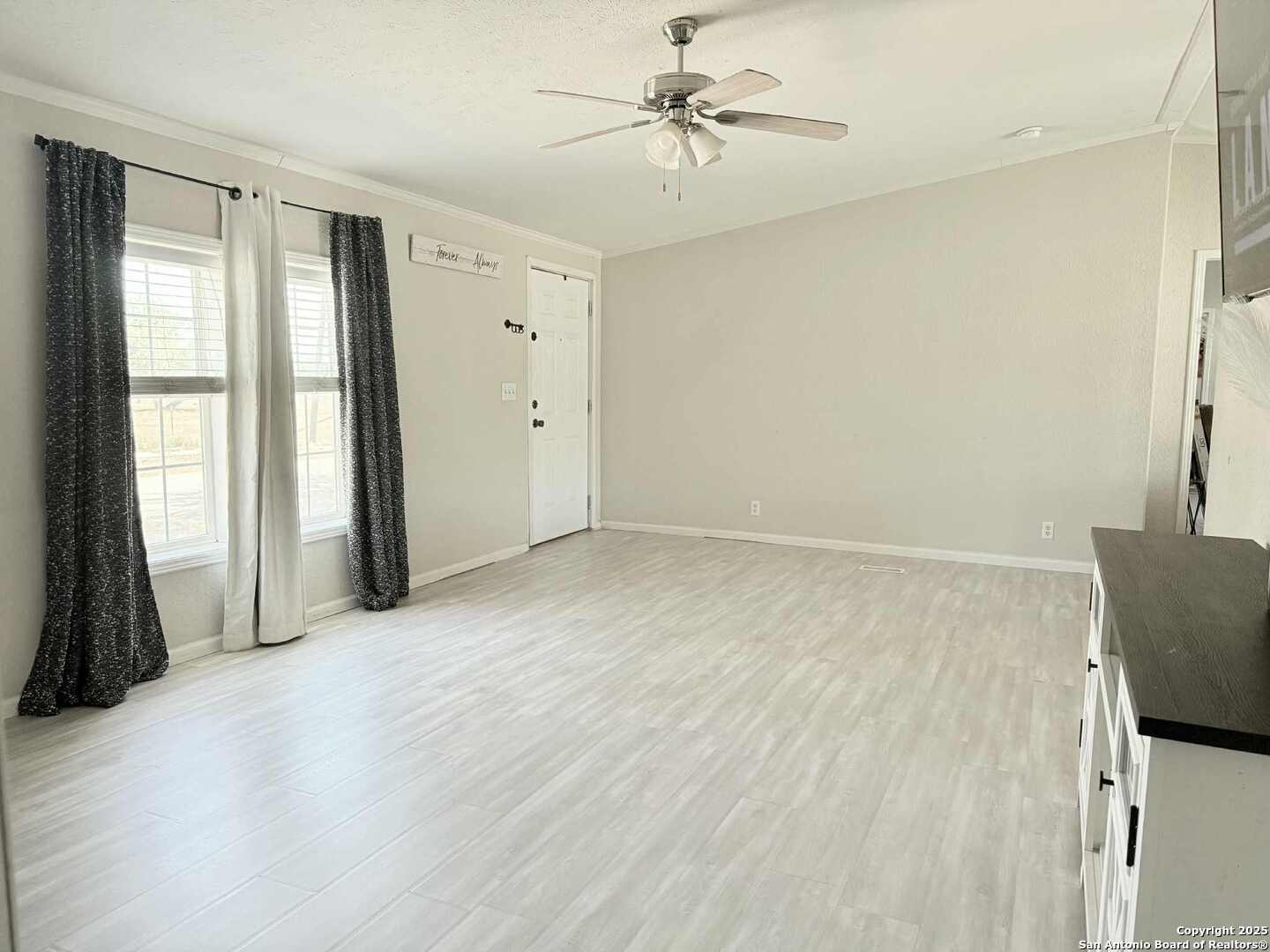 202 South 10th Christine, TX 78012 - Photo 7 of 28 a view of an empty room with a window