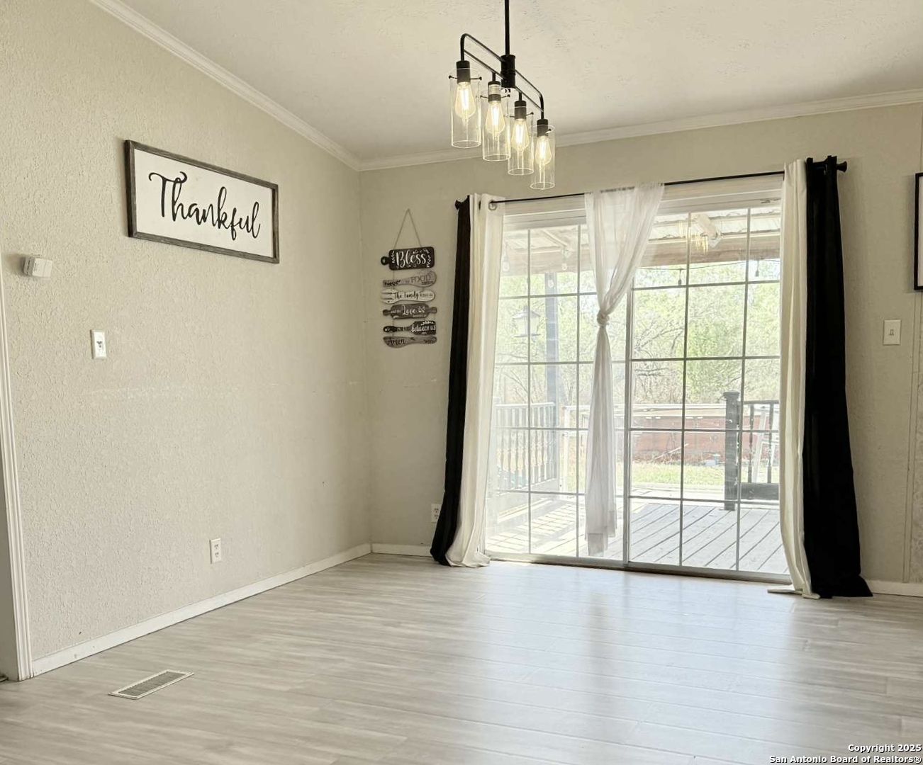 202 South 10th Christine, TX 78012 - Photo 8 of 28 a view of an empty room with a window