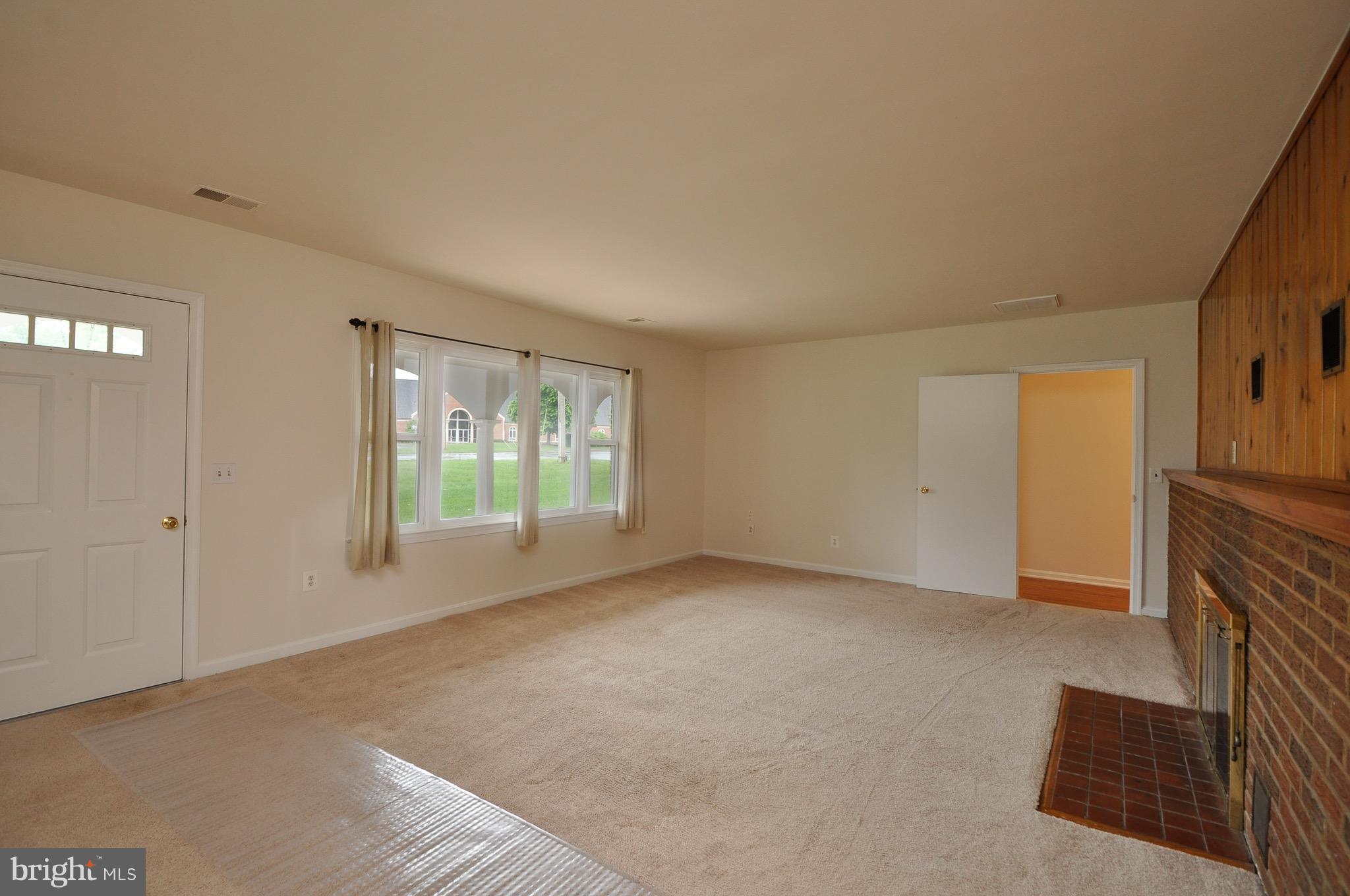 8812 Sudley Road Manassas, VA 20110 - Photo 3 of 30 Living room with fireplace