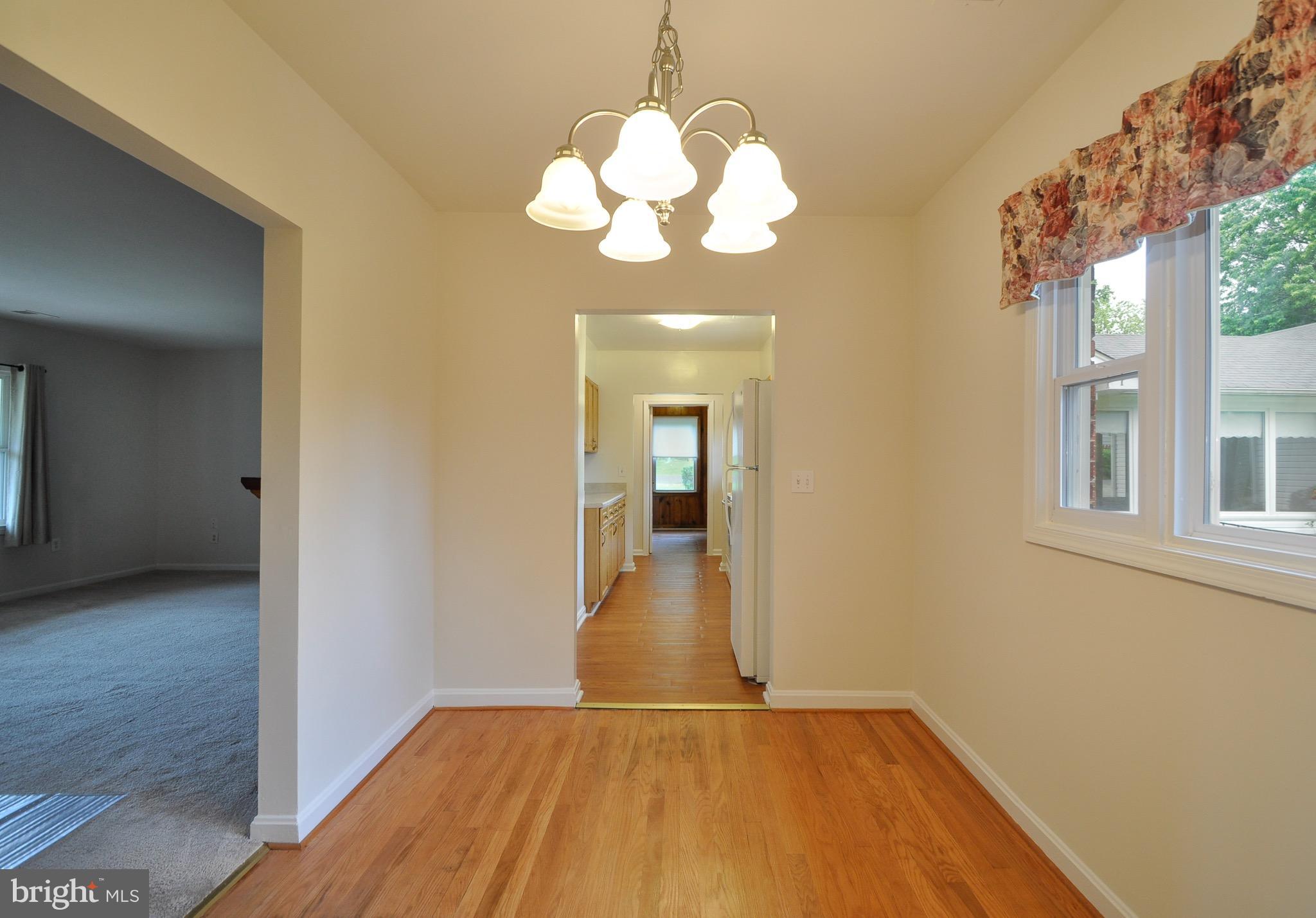 8812 Sudley Road Manassas, VA 20110 - Photo 7 of 30 dining room with refinished wood floors