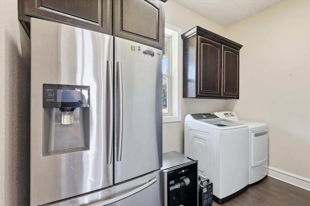 4920 Peden Road Fort Worth, TX 76179 - Photo 12 of 40 Large Laundry Suite with Secondary Fridge Space, Washer and Dryer, and Plumbing for Sink.
