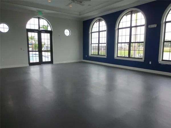 a view of a swimming pool with a table and chairs