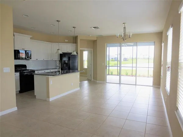 a view of a kitchen with a sink and cabinets