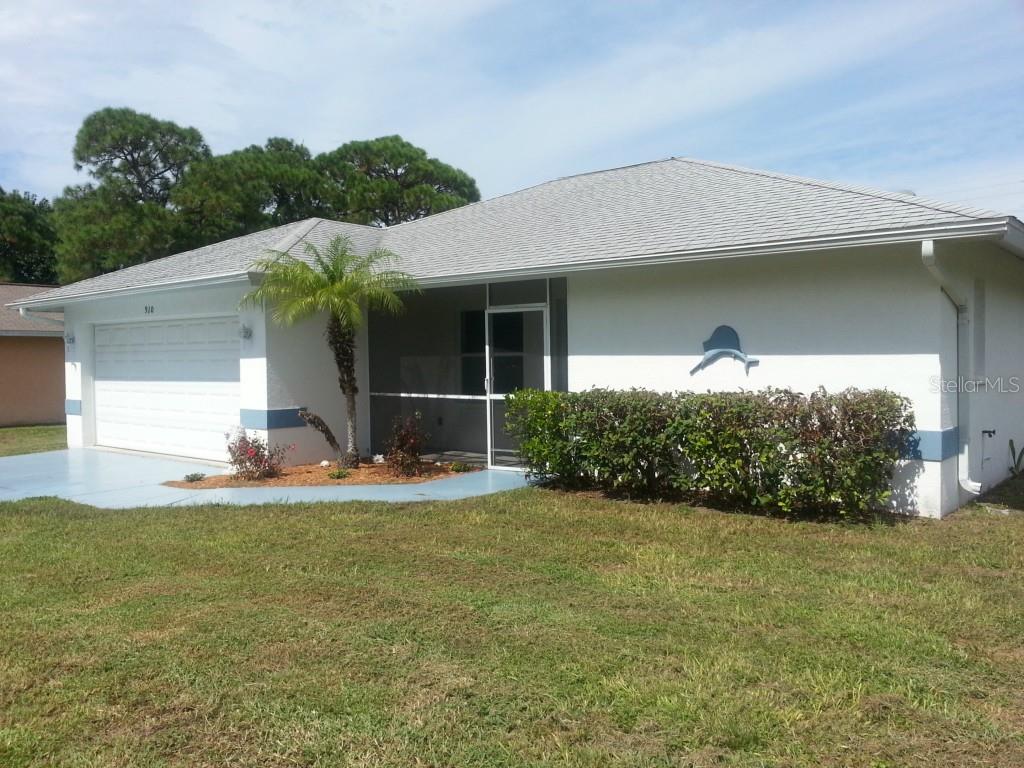 910 Nantucket Road Venice, FL 34293 - Photo 1 of 1 a view of a house with backyard and garden
