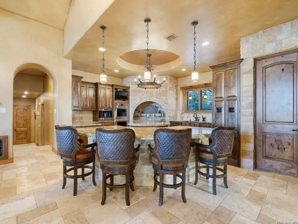 a kitchen with stainless steel appliances granite countertop a stove and a sink
