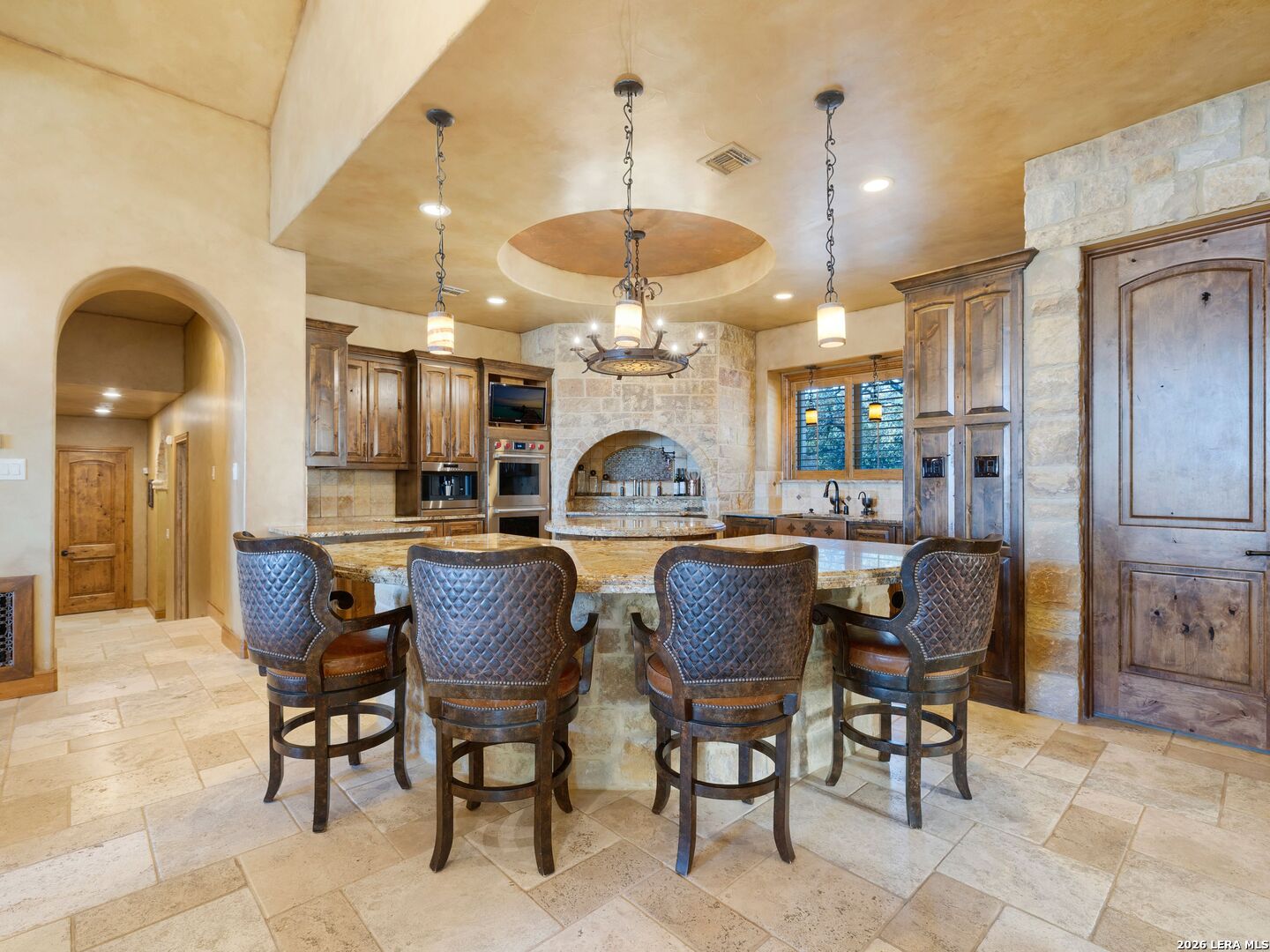 14454 Santa Rita Helotes, TX 78023 - Photo 11 of 70 a dining room with furniture a window and a chandelier