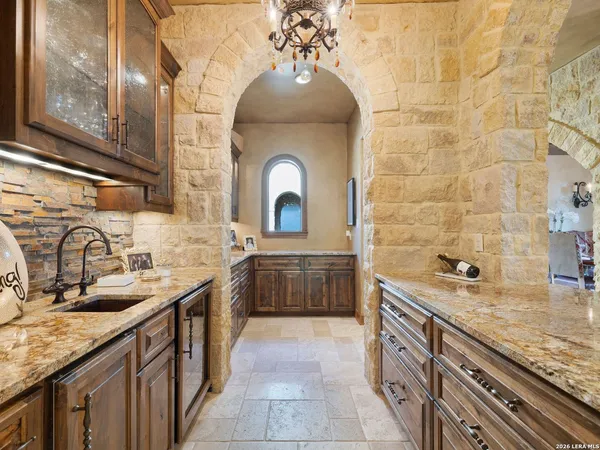 a kitchen with stainless steel appliances granite countertop a stove and a sink
