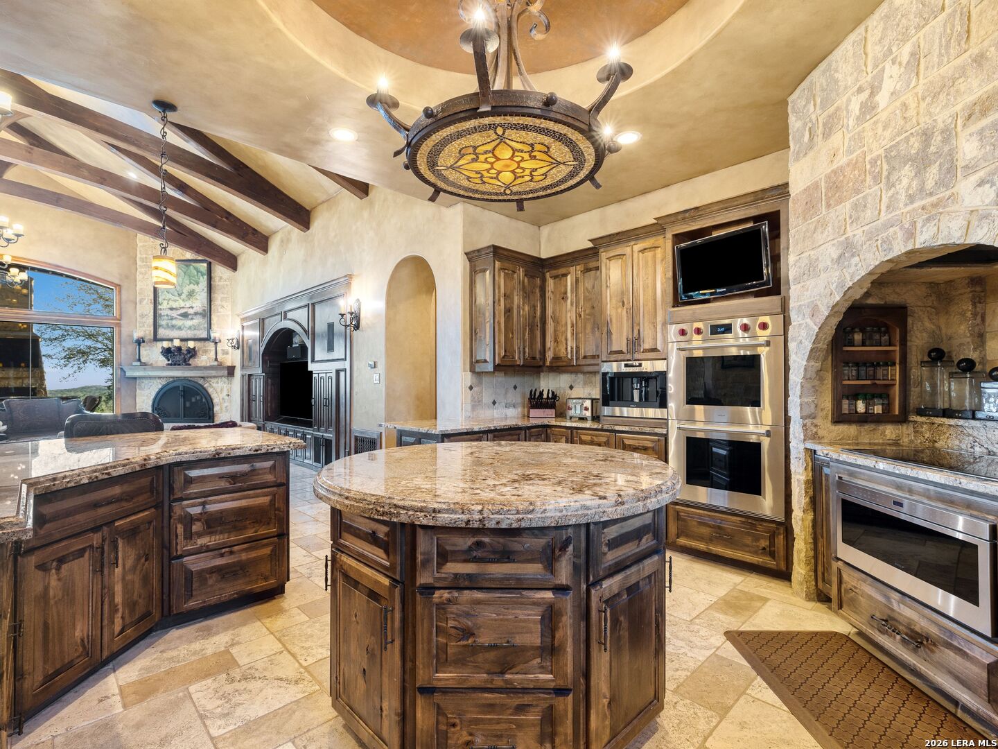 14454 Santa Rita Helotes, TX 78023 - Photo 13 of 70 a kitchen with stainless steel appliances granite countertop a stove and a sink