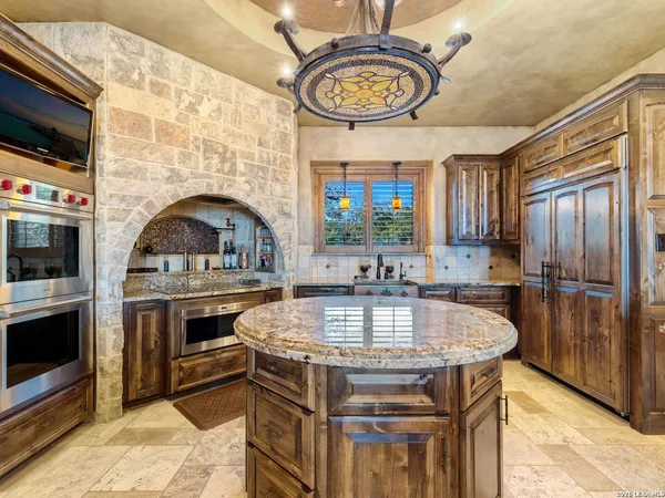 a spacious bedroom with a bed and a large window