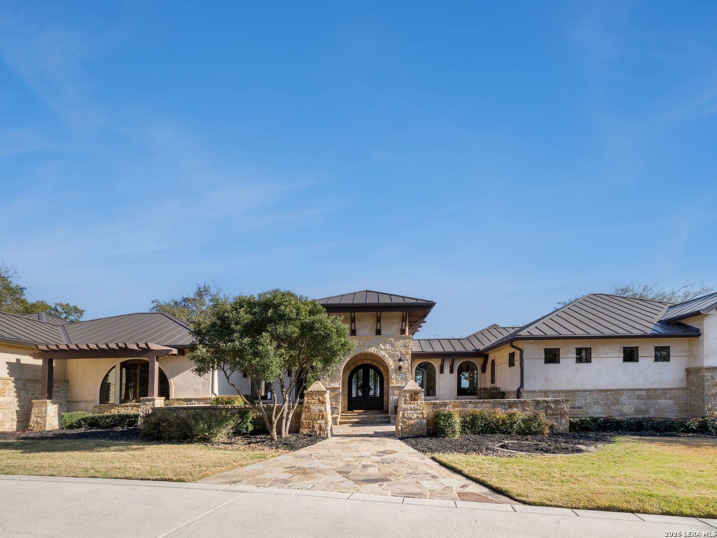 14454 Santa Rita Helotes, TX 78023 - Photo 2 of 70 a front view of a house with a yard