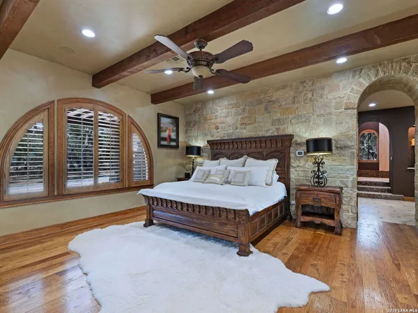 a spacious bathroom with a double vanity sink and a large mirror