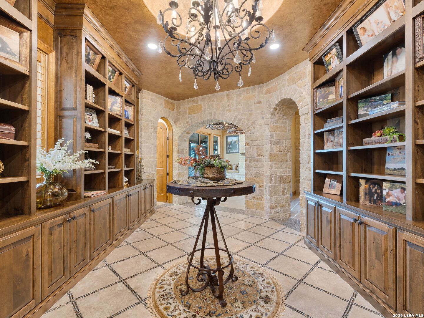 14454 Santa Rita Helotes, TX 78023 - Photo 32 of 70 a table room with a wine shelf and cabinets